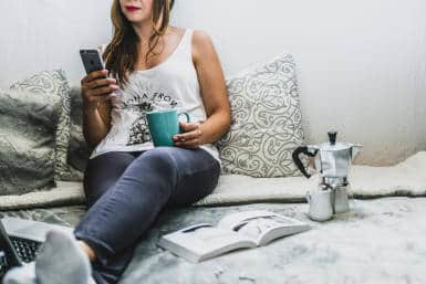 Girl using smartphone at home